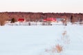 Beautiful early morning winter view of patrimonial white wooden houses with steep red roofs in rural setting Royalty Free Stock Photo