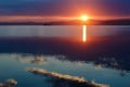 Beautiful early pink dawn over a large lake, quiet morning on the shore of a large lake Royalty Free Stock Photo