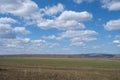 Beautiful early spring landscape with blue sky and white clouds. Pastures, rustic meadow spring landscape. world environment day