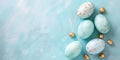 Beautiful Easter background of painted light blue easter eggs with golden decorations. Festive greeting card