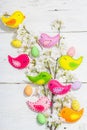 Beautiful Easter background with traditional decor. Flowers, decorative eggs, birds and rabbits