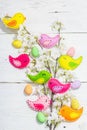 Beautiful Easter background with traditional decor. Flowers, decorative eggs, birds and rabbits