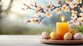 beautiful Easter dinner table featuring colorful eggs, candle, and blooming flowers creates warm atmosphere Royalty Free Stock Photo
