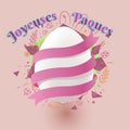 A beautiful easter egg in pink background, joyeuse paques text in french.