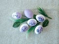 Beautiful Easter eggs on a kitchen towel, purple pattern.