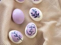 Beautiful Easter eggs on a kitchen towel, purple pattern.