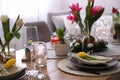 Beautiful Easter table setting with beautiful flowers indoors Royalty Free Stock Photo