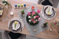 Beautiful Easter table setting with beautiful flowers indoors, flat lay Royalty Free Stock Photo