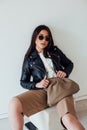 Beautiful fashionable eastern brunette woman in black leather jacket Royalty Free Stock Photo