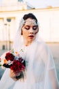 Beautiful eastern style bride with white veil and hairpiece Royalty Free Stock Photo