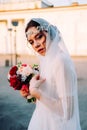 Beautiful eastern style bride with white veil and hairpiece Royalty Free Stock Photo