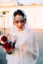 Beautiful eastern style bride with white veil and hairpiece Royalty Free Stock Photo