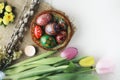 Beautiful Eastern style flat lay with traditional painted eggs and tulips