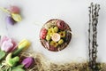 Beautiful Eastern style flat lay with traditional painted eggs and tulips