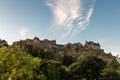 Edinburgh Castle against a blue sky with wispy clouds Royalty Free Stock Photo