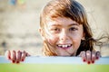 Beautiful eight year old girl smiling on the beach