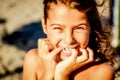 Beautiful eight year old girl smiling on the beach