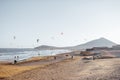 Beach with kite surfers on a sunset Royalty Free Stock Photo