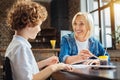 Beautiful elderly lady smiling while talking with grandchild Royalty Free Stock Photo