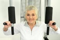 Beautiful elderly woman exercising in the gym Royalty Free Stock Photo