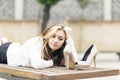 Beautiful elegance young woman lying on bench with heels. Royalty Free Stock Photo