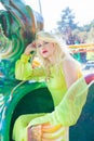 Beautiful elegant blonde fashion woman portrait in amusement park summer Royalty Free Stock Photo