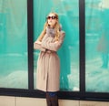 Beautiful elegant blonde woman wearing a coat jacket and sunglasses Royalty Free Stock Photo