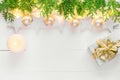 Beautiful elegant Christmas New Year background with stars sparkling golden lights garland balls green cypress gift box candle