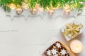Beautiful elegant Christmas New Year background with stars sparkling golden lights garland balls green cypress gift boxes candle c