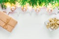 Beautiful elegant Christmas New Year background.white stars sparkling golden lights garland balls green juniper gift boxes on wood Royalty Free Stock Photo