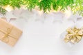 Beautiful elegant Christmas New Year background. White stars sparkling golden lights garland green juniper gift boxes on wood Royalty Free Stock Photo