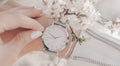 Beautiful elegant classic white watch on woman hand. Close-up photo