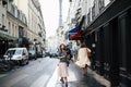 Beautiful elegant girl in Paris on the background of the Eiffel Tower walks around Paris