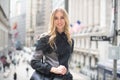 Beautiful elegant lawyer business woman smiling  and walking to the court with a bag on a city street. Royalty Free Stock Photo