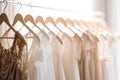 Beautiful elegant luxury bridal dress on hangers. Different wedding dresses hanging on hanger in bridal shop boutique