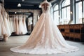 Beautiful, elegant luxury bridal dresses on hangers white wedding gowns in boutique salon