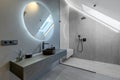 Beautiful Elegant Modern Luxury Bathroom Interior in Luxury Home and Glass Door Shower, Mirror and Sink Royalty Free Stock Photo