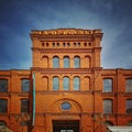 Old brick stone red decorated fasade of textile manufacture in Lodz, Poland Royalty Free Stock Photo