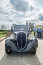 Beautiful classic small vintage car Polski Fiat 508 Balilla parked