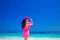 Beautiful elegant woman with hat resting on tropical beach, brunette model posing over blue sky and exotc sea. Lifestyle. Freedom Royalty Free Stock Photo