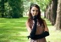 Beautiful elegant young lady enjoying a day in the park. Vintage style. Royalty Free Stock Photo