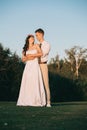 beautiful elegant young wedding couple embracing and smiling each other Royalty Free Stock Photo