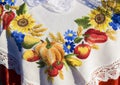 Beautiful embroidered lace white tablecloth with flowers and vegetables, sunny day, Burano, Italy