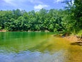 Beautiful emerald green calm water in a quite lagoon on the big lake Royalty Free Stock Photo