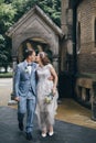 Beautiful emotional wedding couple kissing and walking in european city. Provence wedding. Stylish happy bride and groom walking Royalty Free Stock Photo