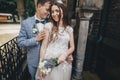 Beautiful emotional wedding couple laughing and hugging in european city. Provence wedding. Stylish happy bride and groom smiling Royalty Free Stock Photo