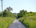 Beautiful empty asphalt road in countryside on colored background