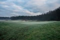 Beautiful empty golf course in the early morning with a yellow flag golf course in winter Royalty Free Stock Photo