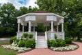 Beautiful White Wood Gazebo at Dellwood Park in Lockport Illinois with Green Trees and Flowers during the Summer