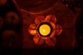 Beautiful enchanting lotus shape candlelabre with burning candle.